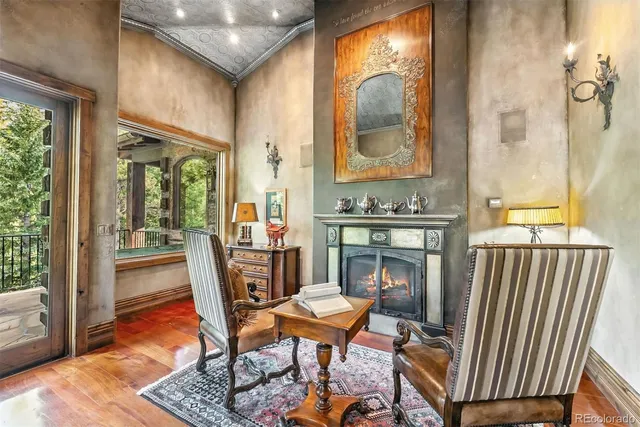 a view of a chair and tables in the balcony