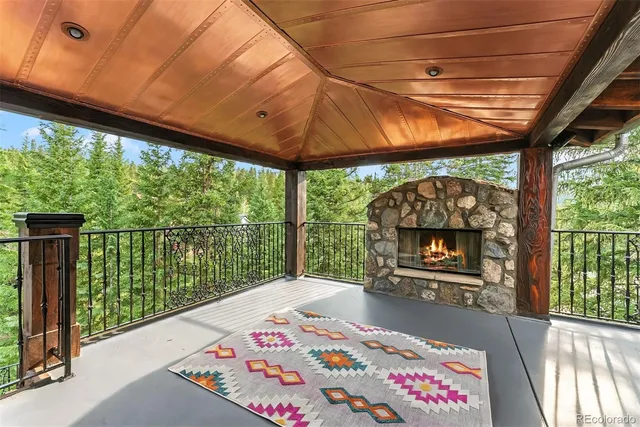 a bed sitting in a spacious bedroom next to a window