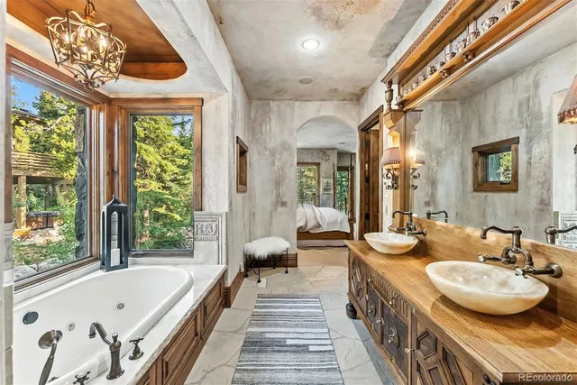 a bedroom with a large bed and a large window