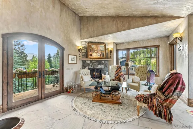 a view of a chairs and table in the balcony