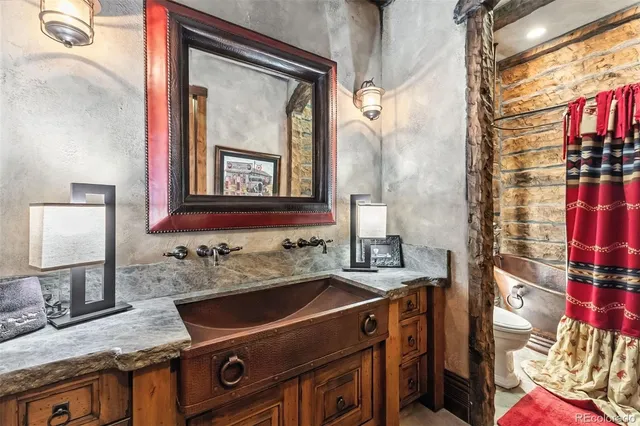 a bathroom with a sink vanity and a mirror