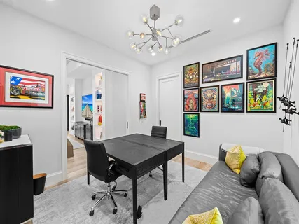 a spacious bedroom with a large bed and a large window