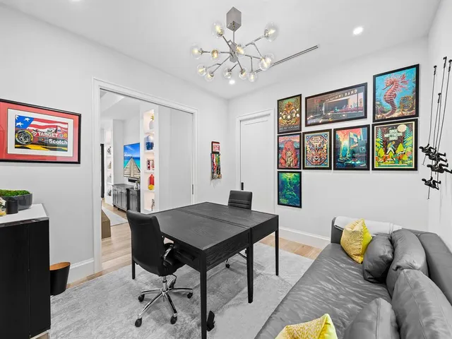 a spacious bedroom with a large bed and a large window