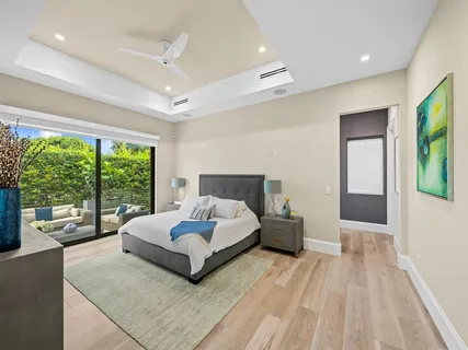 a bedroom with a bed and a night stand