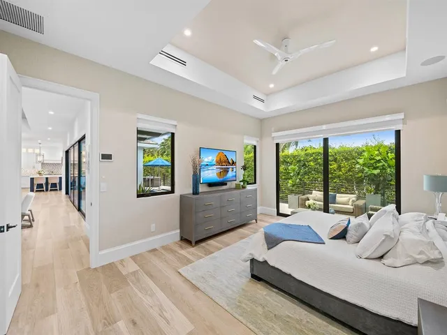 a view of yard from deck with patio