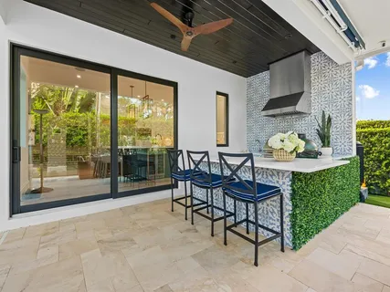 a view of swimming pool with seating space