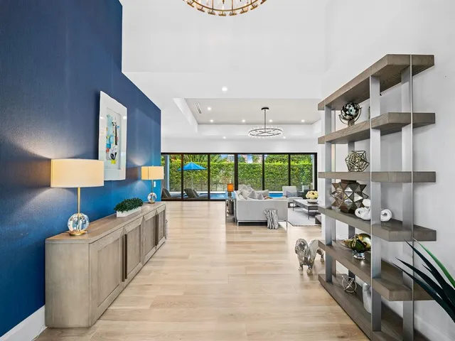 an aerial view of a house with a yard basket ball court and outdoor seating