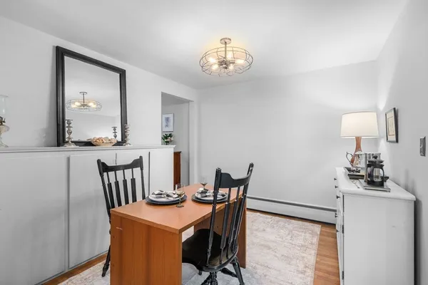 a view of a dining room with furniture and wooden floor