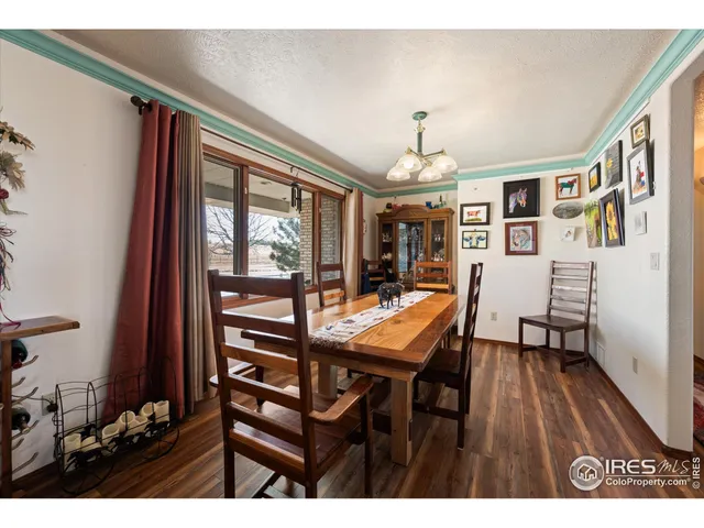a view of a livingroom with furniture window and wooden floor