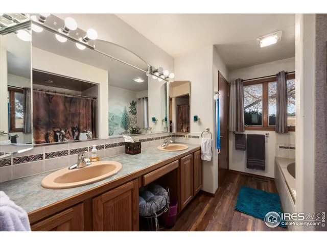 a bathroom with a sink double vanity and a mirror