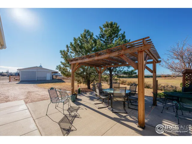 a patio with table and chairs
