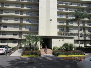 800 Cove Cay Drive, Unit 3C Clearwater, FL 33760 - Photo 1 of 1 a front view of a building with a garden