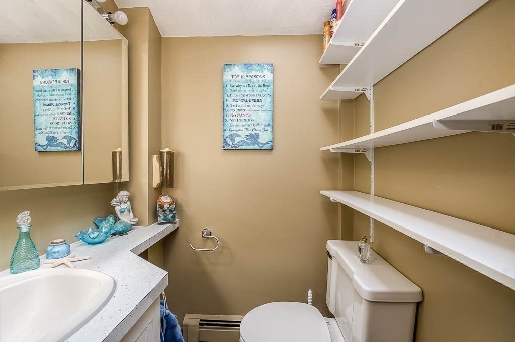 26 Washington Drive Wareham, MA 02571 - Photo 15 of 42 a bathroom with a sink a toilet and mirror