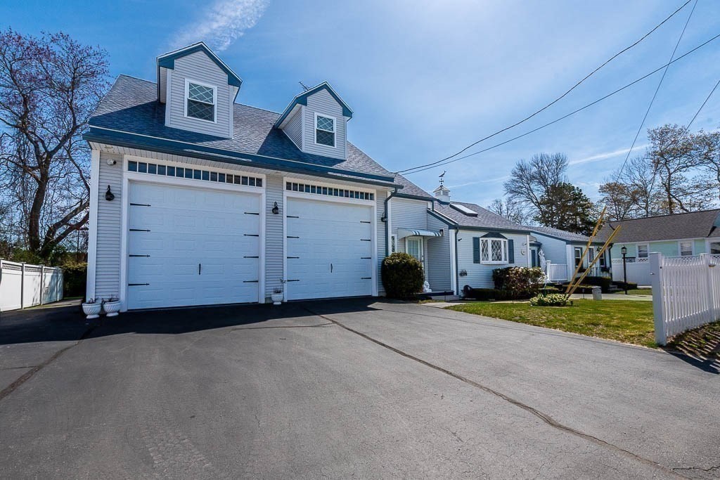 26 Washington Drive Wareham, MA 02571 - Photo 2 of 42 a front view of a house with a yard