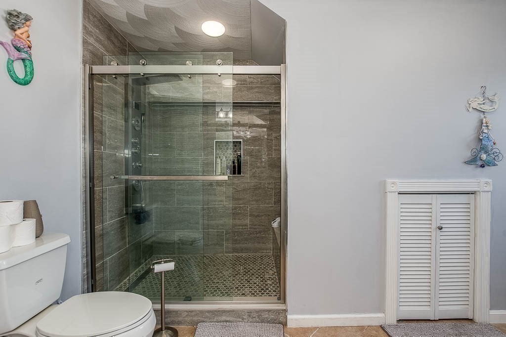 26 Washington Drive Wareham, MA 02571 - Photo 23 of 42 a bathroom with a toilet and a shower