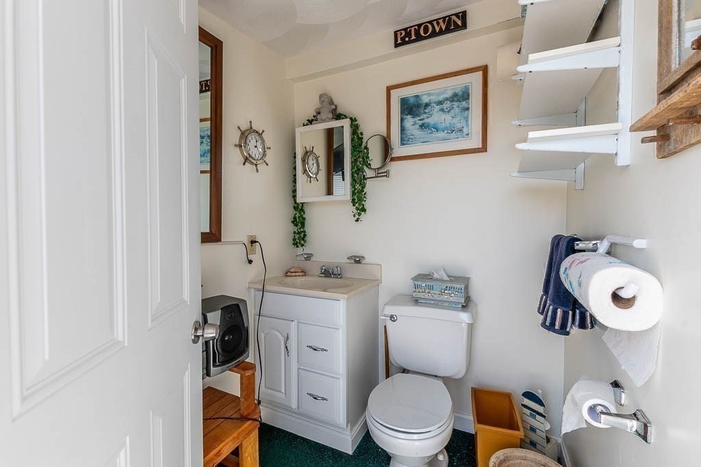 26 Washington Drive Wareham, MA 02571 - Photo 24 of 42 a bathroom with a toilet a sink and a mirror
