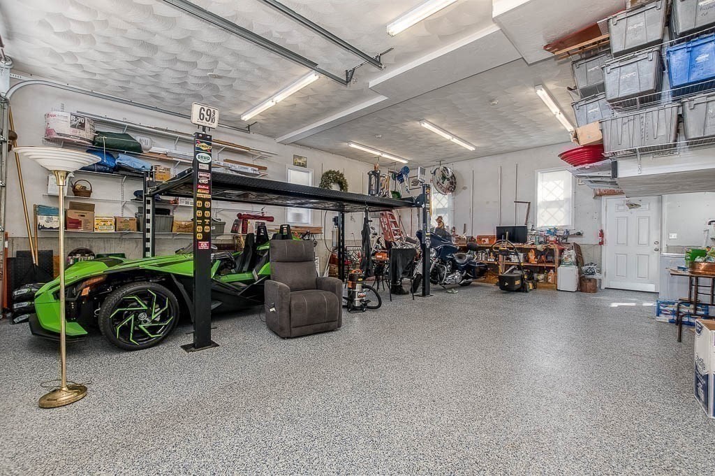 26 Washington Drive Wareham, MA 02571 - Photo 26 of 42 a view of a garage with parked cars