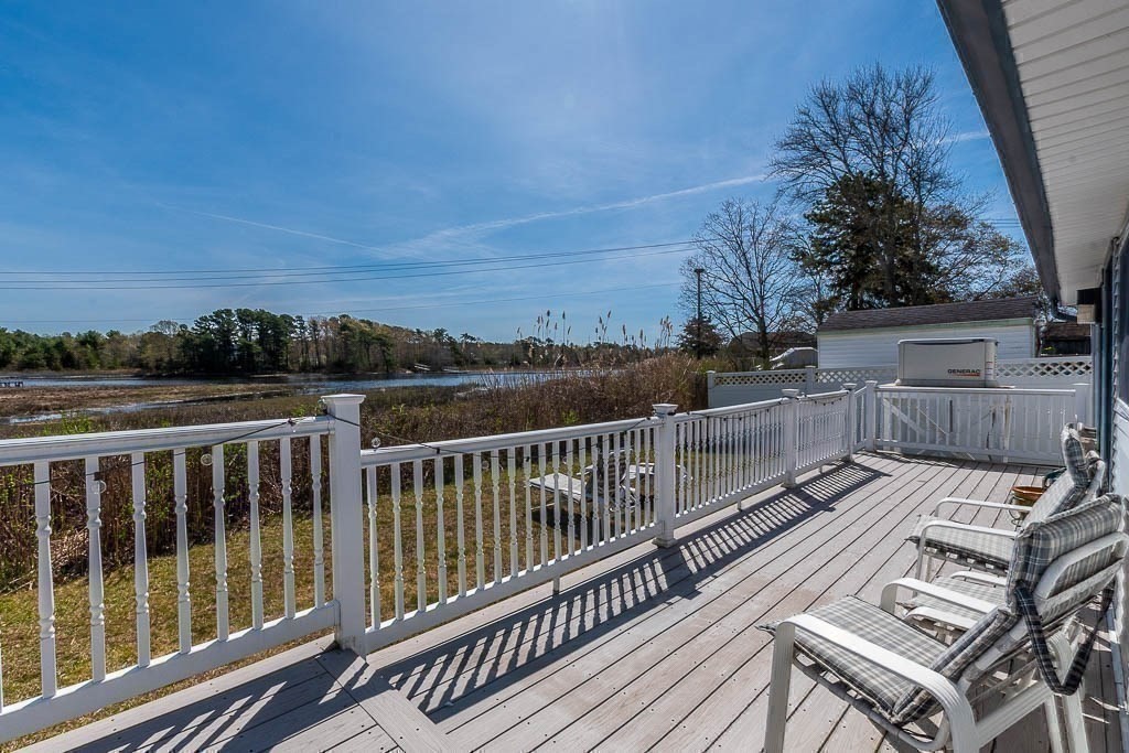 26 Washington Drive Wareham, MA 02571 - Photo 31 of 42 a view of a balcony with wooden floor and fence