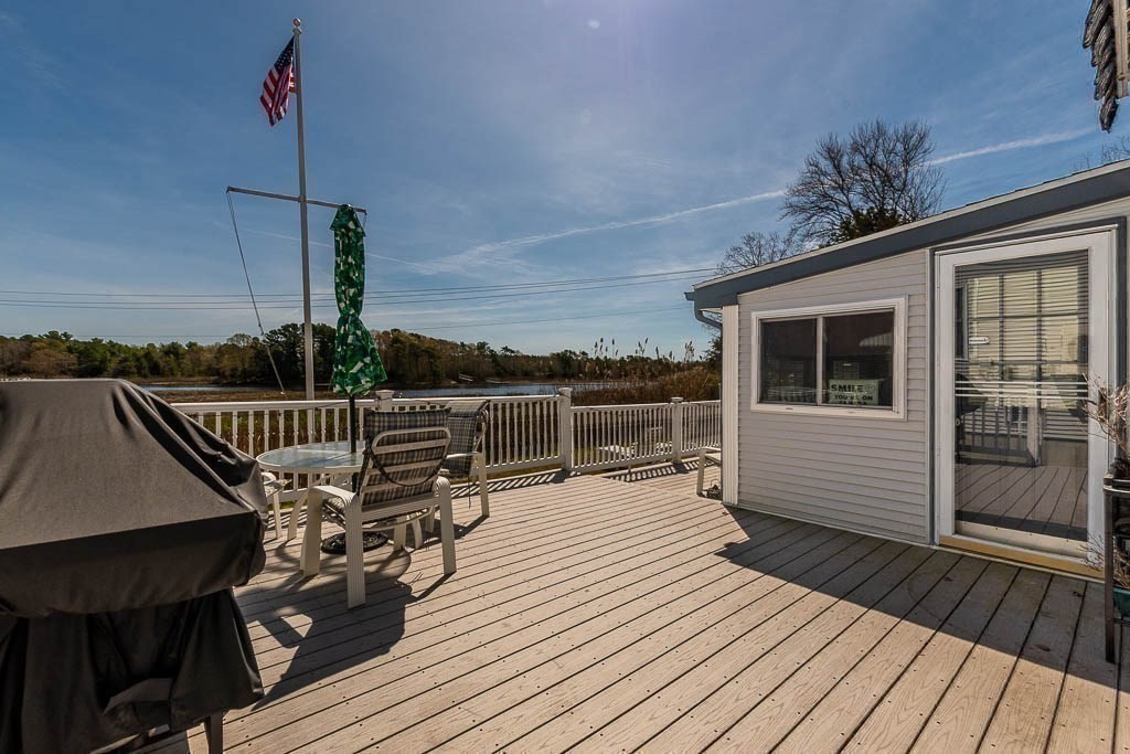 26 Washington Drive Wareham, MA 02571 - Photo 40 of 42 a balcony with wooden floor and outdoor space