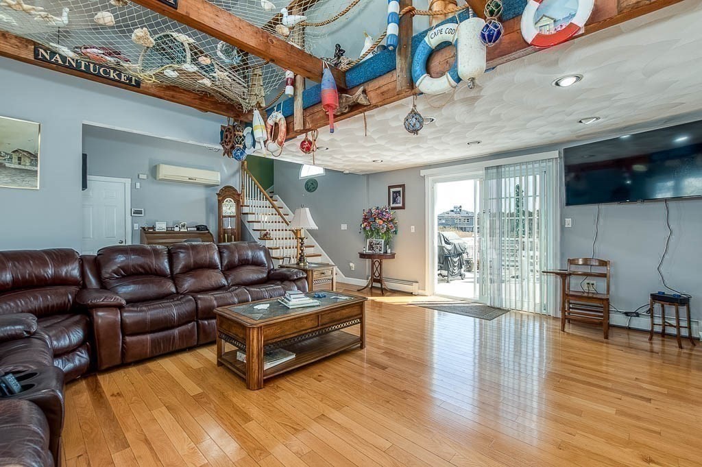 26 Washington Drive Wareham, MA 02571 - Photo 5 of 42 a living room with furniture and a wooden floor