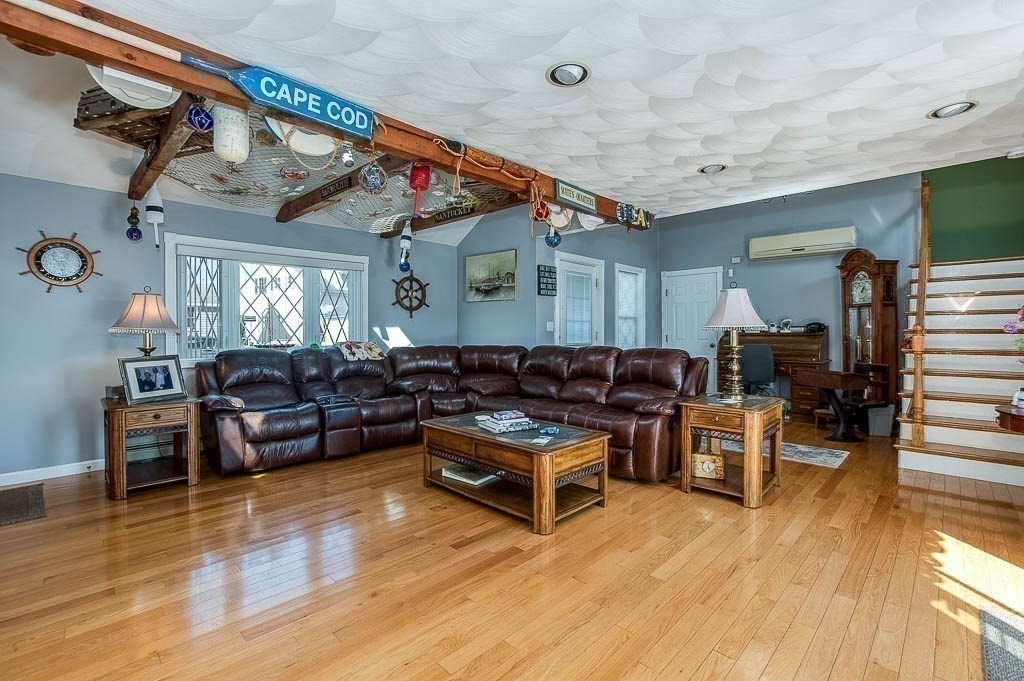 26 Washington Drive Wareham, MA 02571 - Photo 6 of 42 a living room with furniture and wooden floor