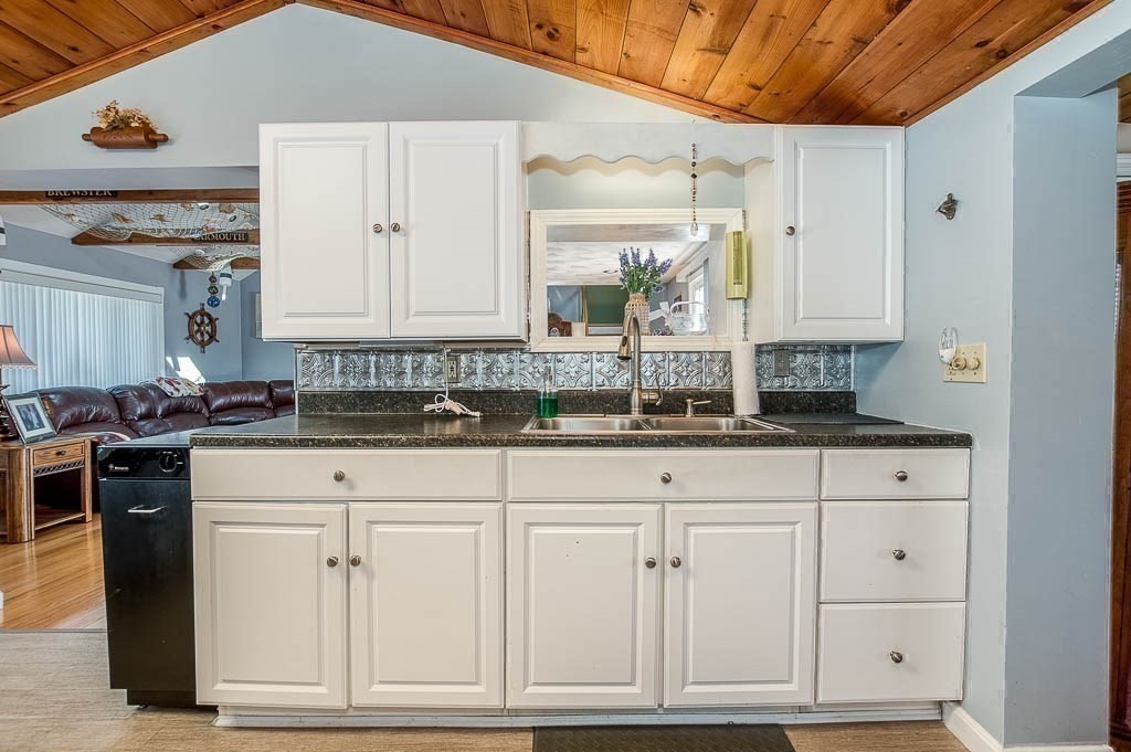26 Washington Drive Wareham, MA 02571 - Photo 9 of 42 a kitchen with granite countertop white cabinets and sink