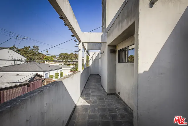 a view of a chairs and table in a patio