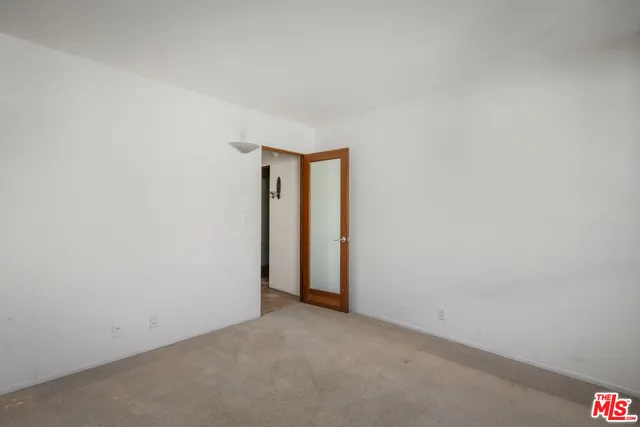 a view of a livingroom from a hallway