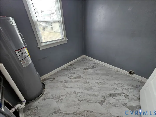 a view of empty room with windows