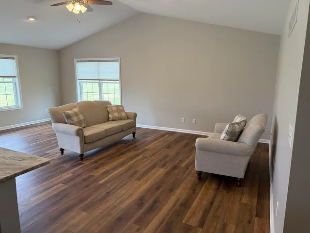 a living room with furniture and a window