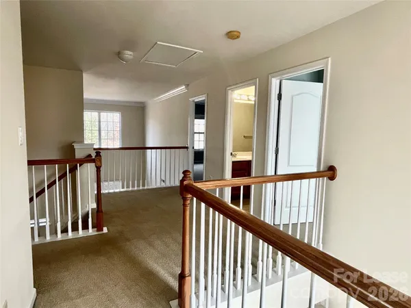 a view of staircase with rug floor