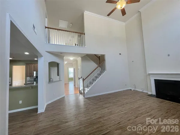 a view of an entryway with wooden floor