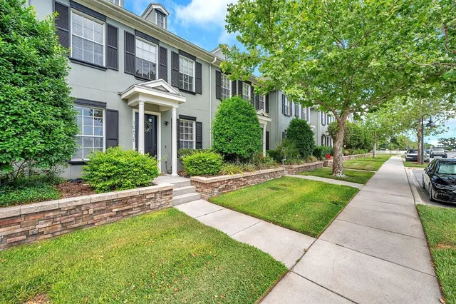 a front view of house and yard with green space