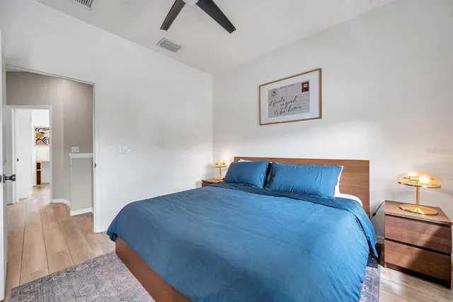 a bedroom with a bed and lamp