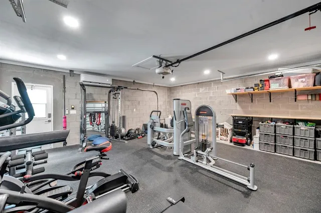 a view of a house with a porch and garden