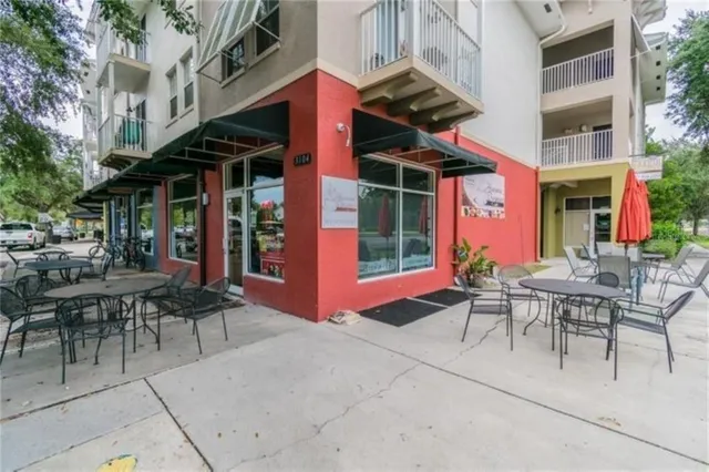 a view of a street with stores
