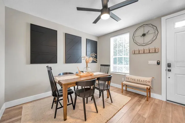 a view of a dining room with furniture and a chandelier
