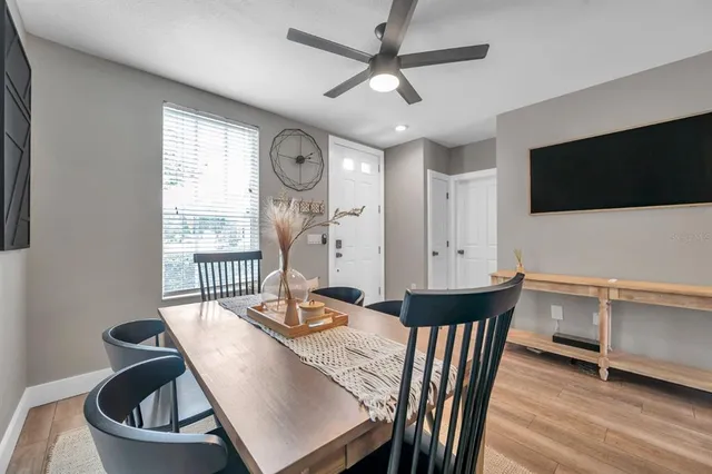 a view of a dining room with furniture window and wooden floor