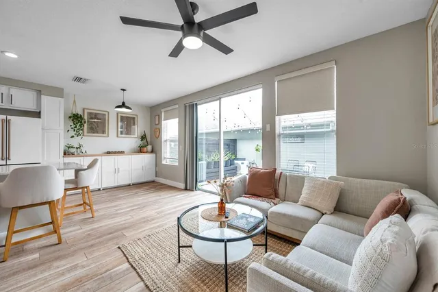 a living room with furniture and a large window