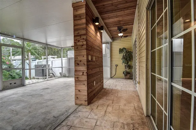 a view of an empty room with windows