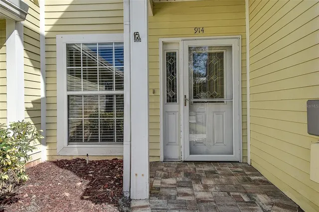 a view of a door with a door and wooden floor