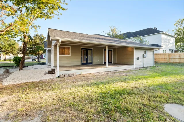 a room that has a window and a dresser in it