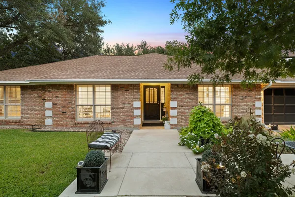 a house view with a garden space