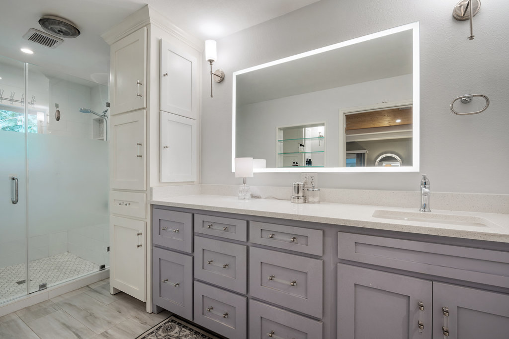 1709 Crested Butte Drive Austin, TX 78746 - Photo 13 of 40 a bathroom with a granite countertop sink mirror and double