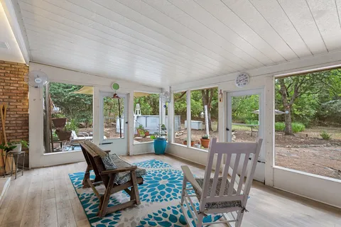 a living room with furniture and windows