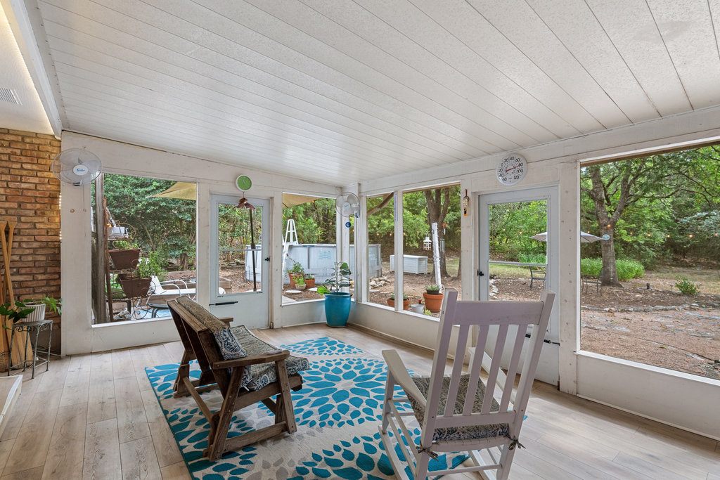 1709 Crested Butte Drive Austin, TX 78746 - Photo 16 of 40 a living room with furniture and windows