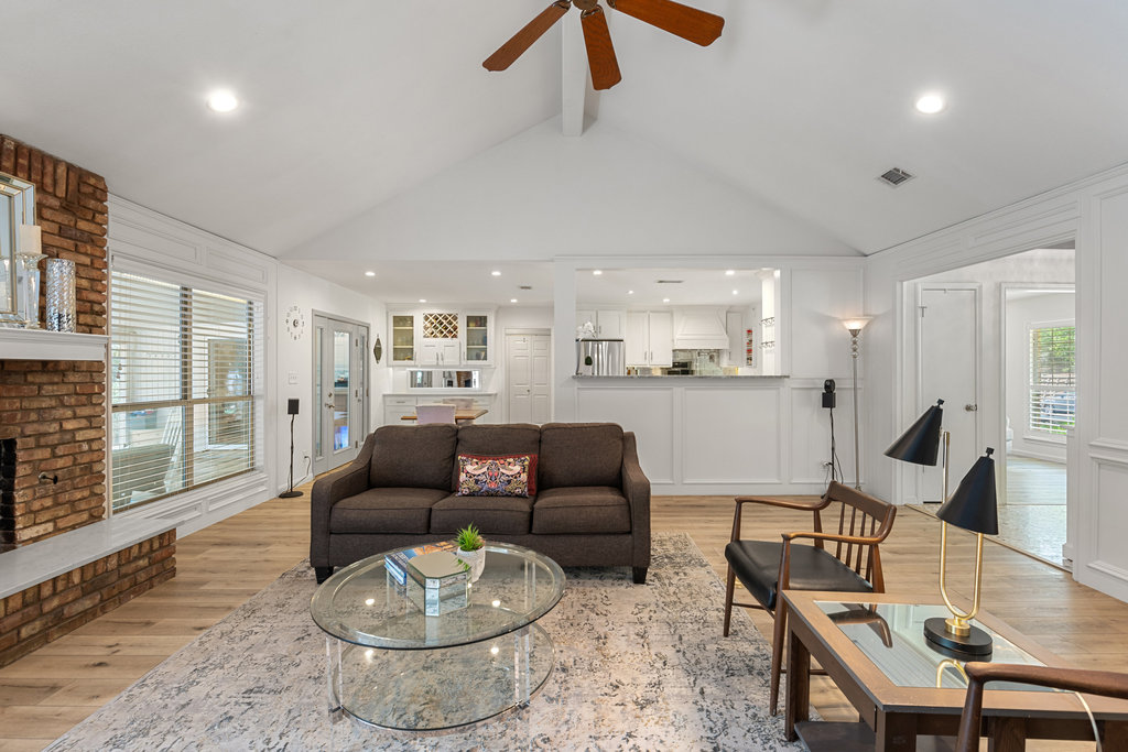 1709 Crested Butte Drive Austin, TX 78746 - Photo 22 of 40 a living room with furniture and a wooden floor