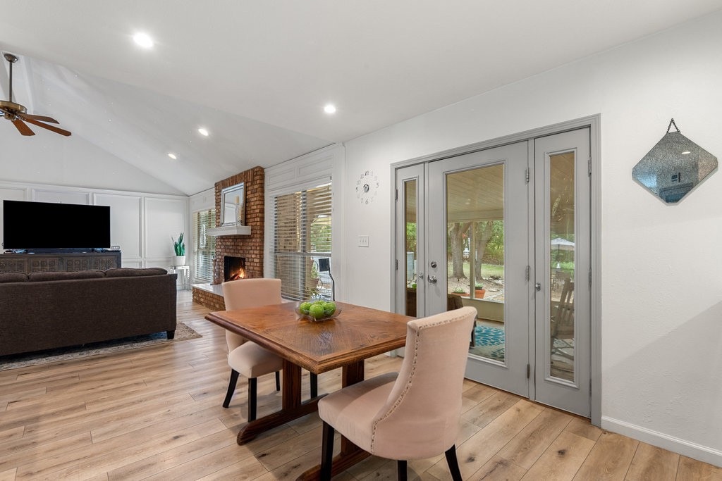 1709 Crested Butte Drive Austin, TX 78746 - Photo 25 of 40 a view of a dining room with furniture window and wooden floor