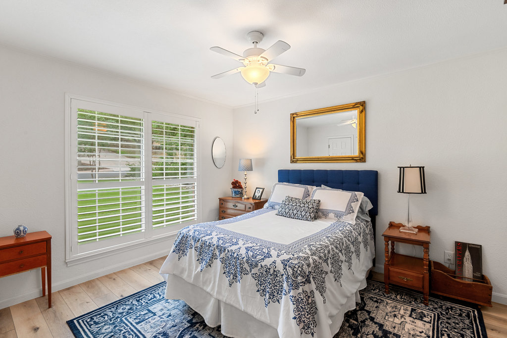 1709 Crested Butte Drive Austin, TX 78746 - Photo 30 of 40 a bedroom with a bed and a window