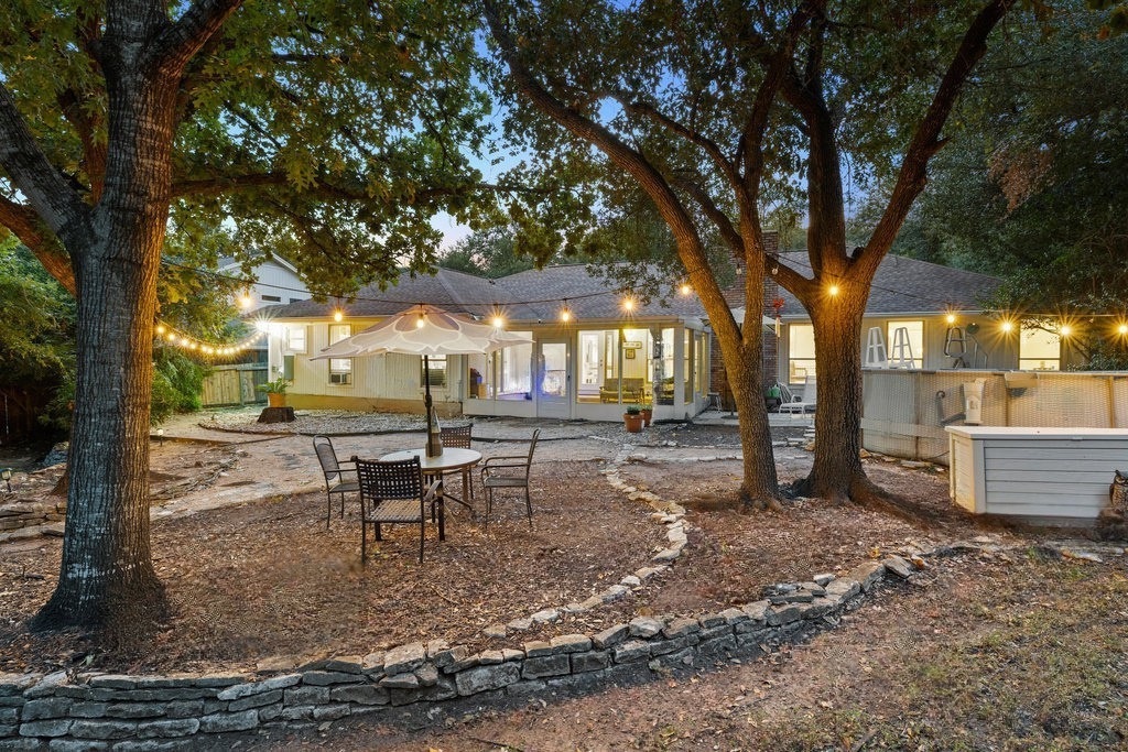 1709 Crested Butte Drive Austin, TX 78746 - Photo 32 of 40 a view of a outdoor space with a patio